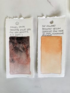 two tags with different shades of paint on them