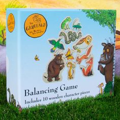 a children's book about balancing game in the grass with trees and animals on it