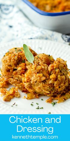 chicken and dressing on a white plate with a blue bowl in the background