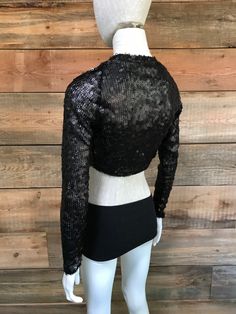 "This shrug is perfect for upcoming holiday parties, as well as any night out that you deserve a little sparkle. It's a great piece to thrown on over a cocktail dress or even a tee and jeans for style, and for a bit more coverage. This most recent cut shapes elegantly around the ribcage and hits a length in the middle of the back. Sizes: S (4-6 women's US size), M (6-8 women's US size) -Fabric content: sequin mesh. Spot clean & Dry clean only. -Feel free to message with any questions or cust Glamorous Winter Tops For Night Out, Winter Party Fitted Shrug, Fitted Winter Crop Top For Evening, Cropped Fall Party Tops, Fall Party Cropped Tops, Cropped Tops For Fall Parties, Fitted Party Tops For Winter, Chic Stretch Shrug For Fall, Fitted Tops For Winter Parties