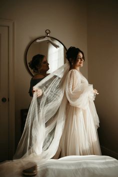 the woman is getting ready to go into her wedding dress