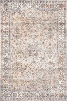 an area rug with various colors and patterns on the floor, including beiges, browns,