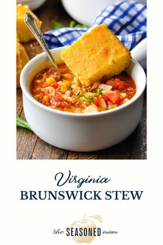 a white bowl filled with soup next to cornbreads and a blue checkered napkin