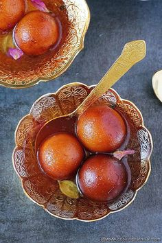 two bowls filled with fruit on top of a table