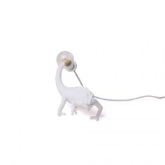 a lamp that is shaped like a monkey with a light on it's head