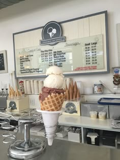 an ice cream shop with cones on the counter