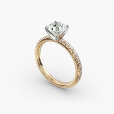 a yellow gold engagement ring with diamonds on the side