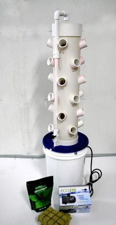 a white bucket filled with lots of different types of pipes and tubes on top of it