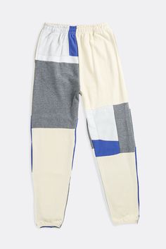 We updated our classic patchwork sweatpants with a straight leg fit for the perfect stack. Upcycled from 3 thrifted sweatshirts. Sourced and reworked in Canada.DetailsSize: Women's S, Men's XS*Unisex fit, men size up Condition: Good Vintage Condition Material Composition: 100% polyesterColour: Blue, grey, cream White Cotton Color Block Pants, Casual Cotton Sweatpants With Contrast Color, Color Block Cotton Bottoms For Streetwear, Casual Patchwork Bottoms For Loungewear, White Color Block Cotton Pants, White Color Block Bottoms For Streetwear, Sporty Cotton Sweatpants With Contrast Color, Color Block Cotton Bottoms For Loungewear, Cotton Color Block Bottoms For Loungewear