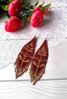 "These red gold beaded earrings pair amazingly with any outfit, dressy or casual. They are made of high-quality Czech colored beads with Surgical steel ear hooks . Colors:red gold Length: 5 inches (12.5 cm) Width: 1.1 inches (3 cm) Materials: Czech \"Preciosa\" beads Durable synthetic thread steel ear hooks" Cheap Red Flower Shaped Beaded Earrings, Elegant Beaded Earrings With Dangling Beads For Festivals, Elegant Dangling Beads Earrings For Festivals, Elegant Dangling Beaded Earrings For Festivals, Red Gold Beaded Drop Earrings, Gold Elegant Tassel Earrings For Festival, Elegant Gold Tassel Earrings For Festival, Red Beaded Earrings With Colorful Beads For Festivals, Red Beaded Chandelier Earrings Gift