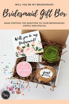 the bridesmaid gift box is filled with cookies and cards