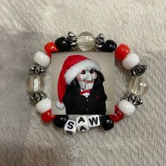 a photo frame with a santa claus mask and beads around it