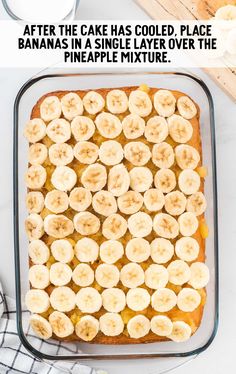 a pan filled with cake covered in banana slices