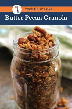 a jar filled with granola sitting on top of a table