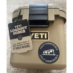 an open yeti toolbox with tags on the lid and tag attached to it