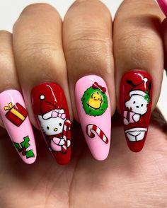 This playful design combines red and pink with beloved holiday characters, creating a fun, festive vibe. Each nail features intricate art, from candy canes to wreaths, perfect for embracing Christmas spirit. Ideal for acrylic nails, this look adds a whimsical charm to your winter nails. Elf Nail Designs, Ginger Bread Nails Christmas, Pink Bow Christmas Nails, Pink Red Christmas Nails, Christmas Cartoon Nails, Character Christmas Nails, Candy Cane Acrylic Nails, Peppermint Nail Art, Nutcracker Nails Designs