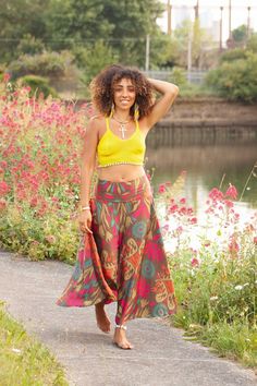 Cool, breezy upcycled sari skirtwith a seventies vibe. Made of beautiful light fabric that's great for summertime lounging. It flows and floats as you walk, a very elegant and feminine skirt.  SIZE  ONE SIZE:  Waistband = 28-36" (71-91.5 cm) Length = 36" (91.5 cm) THIS LISTING IS FOR BOLD FLOWERS Also available in other colours, please check our listings. Code: DRAGONFLY SKIRT (SDDFLY) Hippie Green Maxi Skirt For Vacation, Bohemian Flowy Midi Skirt, Hippie Beach Maxi Skirt, Bohemian Wide Leg Beach Skirt, Multicolor Harem Skirt, Hippie Style Wrap Skirt For Beach In Spring, Hippie Style Spring Beach Wrap Skirt, Hippie Spring Beach Wrap Skirt, Summer Hippie Relaxed Skirt