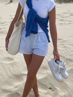 White Blue Striped Pants Outfit, Light Blue Shorts Outfits Women, So Cal Aesthetic Outfits, Blue And White Shorts Outfit, Blue Shirt With White Stripes Outfit, Trendy Style Outfits 2024, Blue Bags Outfit, Blue Striped Pants Outfit Summer, Cardigan Tied Around Shoulders Outfit