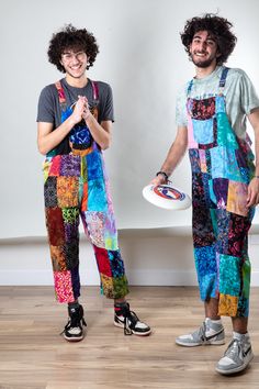 Reap the rewards of the hippie style harvest with these batik patchwork overalls! These uniquely chic unisex overalls feature coconut buttons on the sides and straps, a useful front chest joey pocket, and adjustable straps. The bright colors and eclectic batik patchwork make thesebohemian overalls perfect for any adventure from painting to dancing, globe traveling to road tripping. Boho chic meets high hippie fashion in an explosion of colors and patterns, meet your new favorite overalls!PLEASE Bohemian Overalls Outfit, Patchwork Overalls Outfit, Colorful Overalls Outfit, Festival Patchwork Overalls, Multicolor Festival Overalls, Hippie Style Summer Festival Overalls, Bohemian Overalls, Upcycled Overalls, Colorful Overalls