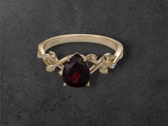 ✨ Introducing our stunning 925 Sterling Silver Natural Garnet Ring! ✨  Crafted with love and care, this beautiful ring features a gorgeous pear-shaped garnet that radiates a rich, vibrant red color, symbolizing passion and love. Set in a luxurious 925 sterling silver band with a touch of gold, this ring is perfect for any occasion--whether it's a special event or a little treat for yourself! 💖 🤩 Why You'll Love It: Handmade Quality: Each ring is meticulously crafted for a unique touch. Vibrant Pear Ring, Red Gemstones, Garnet Ring, Touch Of Gold, Garnet Rings, Beautiful Ring, Sterling Silver Bands, High Quality Jewelry, Vibrant Red