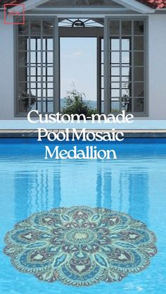 the pool mosaic medallion is in front of an open door to a swimming pool area