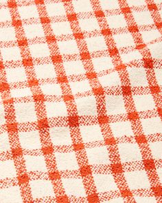 an orange and white checkered table cloth