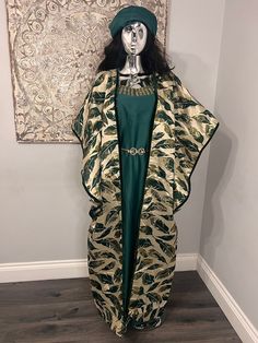 African/Nigeria bubu brocade outfit. One size. Please note measurements: Width: 52inches Arm hole: 20inches Length: 60inches Festive Long Kaftan, Traditional Fitted Kaftan With Kimono Sleeves, Festive Long Free Size Kaftan, Bohemian Style Long Agbada For Festive Occasions, Traditional Cape Style Festive Kaftan, Traditional Cape Kaftan For Festive Occasions, Festive Bohemian Style Long Agbada, Festive Long Green Abaya, Fitted Long Festive Kimono