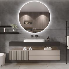 a bathroom with a round mirror above the sink