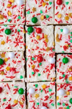 christmas sprinkles and candies are arranged on top of white frosted squares