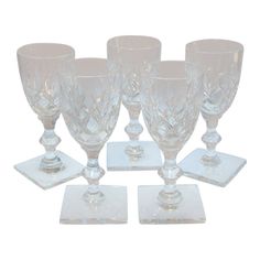 six crystal goblets sitting on top of each other