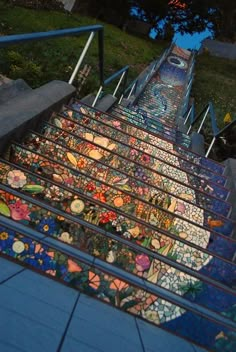 the stairs are decorated with stained glass flowers