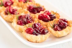 small cranberry tarts on a white plate