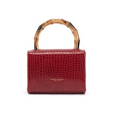 Delightful handbag with a distinctive crocodile print texture and a compact square design. It is perfect to match any outfit thanks to the elegant bamboo-effect handle and the removable shoulder strap made of gold-coloured metal chain. Ideal for holding lipstick, card holders, house keys and all your small personal accessories. Wear it for an aperitif, a walk or dinner with friends. FEATURES Carried on the shoulder and in the hand. Removable shoulder strap. Handle height: 10 cm. Dimensions: 18 x 14, 5 x 6 cm; weight: 310 g. Wipe clean with damp cloth only. Holding Lipstick, Stocking Fillers For Him, Alphabet Jewelry, Overnight Travel Bag, Gift Wrap Tags, Print Texture, House Keys, Stocking Fillers For Her, Crocodile Print