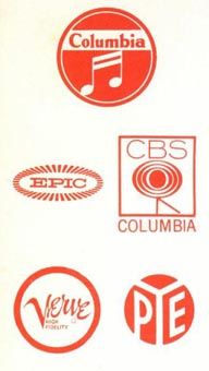 various logos and stickers on a white sheet that says columbia, cbs, we are