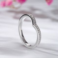 Simple and elegant, this unique ring features sparkling round stones on a plain band. It's beautiful, elegant, and truly statement-making. Smooth finish provides a comfortable fit for everyday wear. Never miss it.Carat Weight: 0.25 ctStone Size: 1 mmStone Type: Jeulia® StoneNumber of Stones: 25 Weight: 2.1 gWidth: 2.2 mmHeight: 2 mmThickness: 1.4 mmMaterial: 925 SilverPlating Color: Silver Plain Bands, Unique Ring, Unique Rings, Quality Jewelry, Diamond White, Stone Color, 925 Silver, Bespoke, Everyday Wear