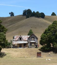 an old run down house in the middle of nowhere