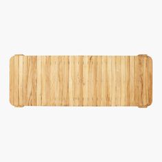 a bamboo cutting board on a white background