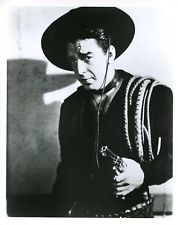 black and white photograph of a man wearing a cowboy hat