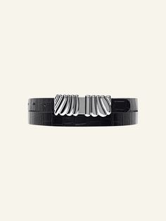 Add a luxurious statement to your everyday look with the Selene Belt. Made with 100% leather with a stone detail and a beautiful custom silver statement buckle. Item Details: Metal buckle detail Adjustment: 8 holes Strap Width: 20mm Genuine Leather Sizing: XS/S: 32'': Depending on where you like your belt to sit, fits jean size 24, 25, 26, 27. M/L: 37'': Depending on where you like your belt to sit, fits jean size 27, 28, 29, 30. Measurement is taken from the buckle point to the third hole. Gift Wrapping Available Each piece comes in its own luxury Love Isabelle Packaging with one gift box per order. Modern Leather Belt With Silver Buckle, Classic Silver Belt With Palladium Hardware, Luxury Leather Belts With Silver Buckle, Modern Black Belt With Silver Buckle, Modern Formal Belt With Silver Buckle, Modern Formal Belts With Silver Buckle, Chic Black Belt Buckles For Evening, Modern Leather Belt Buckles With Palladium Hardware, Timeless Black Belt Buckles For Workwear