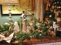 a mantle with christmas decorations and candles on it