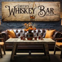 a living room filled with furniture and a wooden sign on the wall above it that says smith's whiskey bar