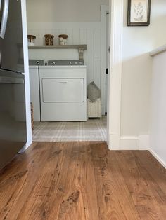 the kitchen is clean and ready to be used as a washer and dryer