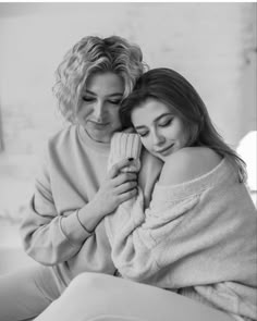 black and white photograph of two women wrapped in blankets