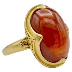 This deep orange tourmaline cabochon Steven Battelle Designed ring is approximately 9.80 ct. and glows from within. The granular 18k gold setting beautifully frames the oval stone. The ring size is 7 1/8 and can be sized to fit your finger. Orange Gemstones, Medieval Rings, Blue Star Sapphire, Rubellite Tourmaline, Deep Orange, Tanzanite Ring, Diamond Cocktail Rings, Modern Ring, Enamel Ring