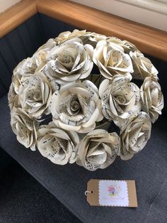 a bouquet of paper flowers sitting on top of a couch