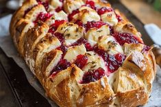 a pastry with cranberry sauce and other toppings