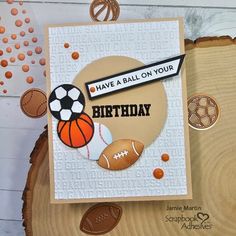 a handmade birthday card with an orange and black ball on it's side