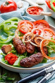 a plate filled with meat and vegetables on top of a table