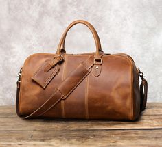 20" Leather Duffel Bag, Personalized Leather Travel Bag, Weekend Bag, Overnight Bag, Vintage Luggage Bag, Genuine Leather Handbag, Holdall, Gift. It can be Personalized and will be your best companion for travel or vacation... Features: * Dimensions: L 20 x H 13 x D 9 inches, fit for 15.6" laptop, can put 16" tablet; * Made with worlds famous crazy horse leather; * 100% Genuine leather, retro style, simple, thick and durable; * It's a great gift for friends, colleagues or family! Personalization Rectangular Duffle Bag Gift, Brown Travel Bag With Luggage Sleeve As Gift, Leather Travel Bag With Luggage Sleeve As Gift, Large Leather Travel Bag Ideal As Gift, Brown Duffle Bag With Luggage Sleeve As Gift, Rectangular Duffle Bag With Luggage Sleeve As Gift, Large Capacity Rectangular Duffle Bag Gift, Leather Duffel Bag, Leather Duffel