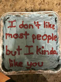 a cake with writing on it that says i don't like most people but i kinda like you